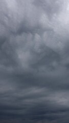 Wall Mural - Vertical time lapse of sky and flying clouds
