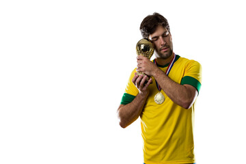 Wall Mural - Brazilian soccer player, celebrating the championship with a trophy in his hand