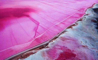 top view of the salt-covered shore of pink lake.