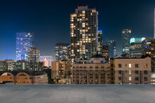 Skyscrapers Cityscape Downtown, Los Angeles Skyline Buildings. Beautiful Real Estate. Night Time. Empty Rooftop View. Success Concept.