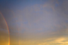 Colorful Round Rainbow Against Blue Evening Sky After Heavy Thunderstorm