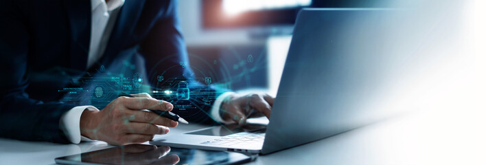 Poster - .Businessman using laptop and encryption of business data network with fingerprint scanning and Biometric identification of security, Protect business transaction from digital cyber attack.