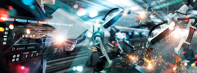 Fototapete - Industrial engineer, Technician manager control robotics on monitoring system software and icon industry network connection on tablet. AI. Automation robot arm machine in smart factory. Industry 4.0