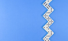 White Domino Stacked Herringbone On A Blue Background