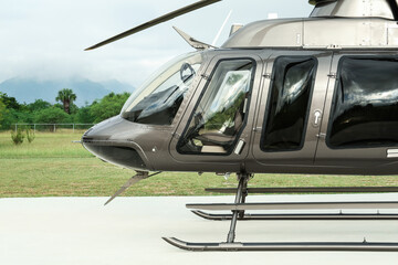 Wall Mural - Beautiful modern helicopter on helipad in field