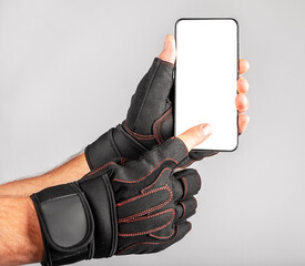 Poster - Phone screen mockup for sport application, gym workout app advertisement. Smartphone mock up, blank white display in athlete hand. High quality photo