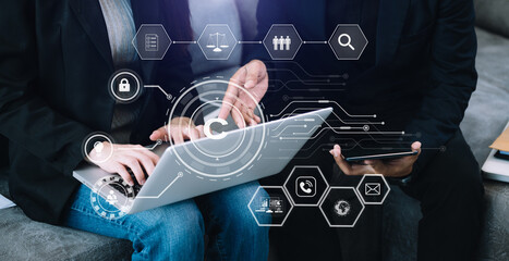 Wall Mural - Copyright or patent concept, Business team analyzing data and using smart phone and tablet with virtual screen copyright icon trademark license, Creation ownership against piracy.