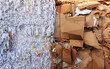 © Jarama - stack of shredded old waste paper and cardboard in front of recycling facility