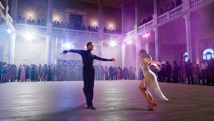 Wall Mural - Couple dancers  perform latin dance on large professional stage. Ballroom dancing.