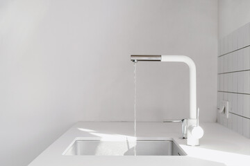 Wall Mural - modern sink and water flowing from faucet at kitchen