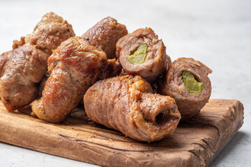 Wall Mural - Meat rolls stuffed with mustard and pickled cucumber braised in gravy