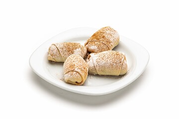 Sticker - Isolated shot of a plate of pastries on a white background