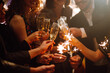 © maxbelchenko - Sparkling sparklers in the hands of friends.Group of people holding sparklers at party. Winter holidays, vacation, relax and lifestyle concept.