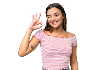 Wall Mural - Young caucasian woman isolated on green chroma background showing ok sign with fingers