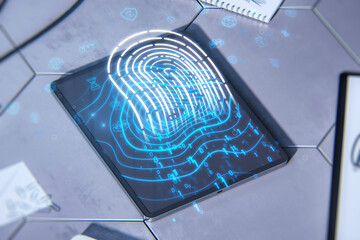 Poster - Close up of tablet on desktop with supplies and glowing digital fingerprint hologram. Digital ID, safety and authentication concept. Double exposure.