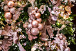 Pink balls and decorations on a Christmas background in pastel soft colors. Stylish and trendy Christmas tree decoration.
