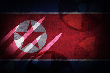 Poster - North Korea flag with nuclear missile signs and grunge texture effect. North Korea atomic weapons concept background