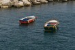 Scenic view of colorful row boats anchored by the shore of a city