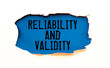 © Uladzislau - A sign with the inscription Reliability and Validity on the table with office supplies