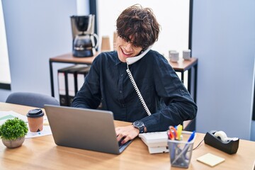 Sticker - Young hispanic man business worker talking on the telephone working at office