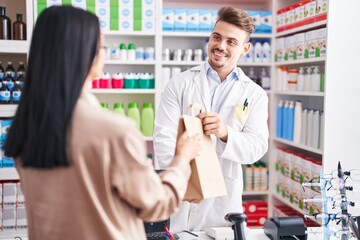 Poster - Man and woman pharmacist and client holding shopping bag at pharmacy