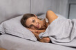 © F8  \ Suport Ukraine - Pretty woman lying down on her bed at home before sleep