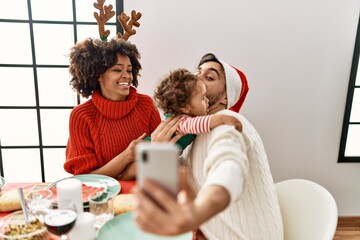 Sticker - Couple and daughter make video call by the smartphone having christmas dinner at home