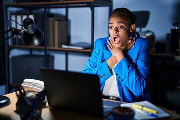 Sticker - Beautiful african american woman working at the office at night shouting and suffocate because painful strangle. health problem. asphyxiate and suicide concept.