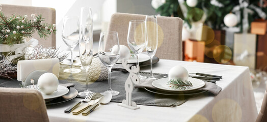 Stylish table setting for Christmas dinner in room