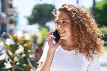 Poster - Young beautiful hispanic woman smiling confident talking on the smartphone at park