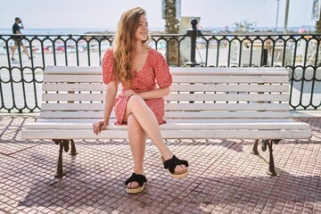 Wall Mural - Young caucasian girl smiling confident at seaside