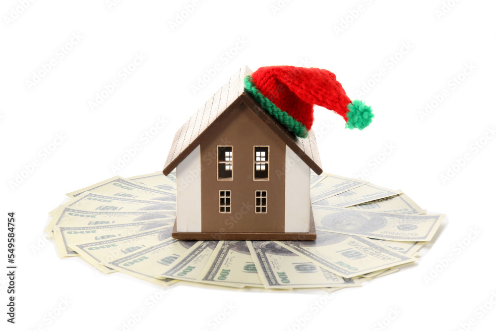 House model with hat and dollar banknotes on white background. Heating concept