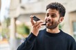 © Krakenimages.com - Young arab man smiling confident talking on the smartphone at street