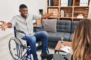 Poster - African american man doing therapy sitting on wheelchair looking at the camera smiling with open arms for hug. cheerful expression embracing happiness.