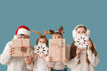 Sticker - Happy family with Christmas gifts and snowflakes on blue background