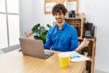 Wall Mural - Young hispanic man meditating doing yoga exercise at office