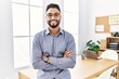 © Krakenimages.com - Young arab man smiling confident standing with arms crossed gesture at office