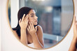 © Rene L/peopleimages.com - Skincare, facial and woman by a mirror to check for acne breakout or pimples while cleaning face in bathroom. Beauty, wellness and healthy girl grooming or checking cosmetics results or prp progress