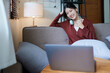 © Jirapong - Portrait of a beautiful Asian teenage girl using a computer