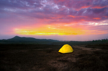 Wall Mural - camping with yellow tent under the beautiful sky in the morning before the sunrise, lampang, thailan