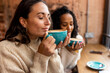 © Westend61 - Women enjoying coffee at cafe