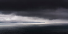 UK, Scotland, Panoramic View Of Dark Dramatic Clouds Over Saint Magnus Bay