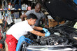 © feeling lucky - Group of car mechanic men in half uniform checking maintenance a car service at repair garage station. Worker holding wrench and fixing breakdown vehicle. Concept of car center repair service.