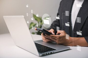 Fototapete - Businessmen use laptops to searching, managing and access information  in files online document database, for efficient archiving and company data. Document Management System (DMS) concept.