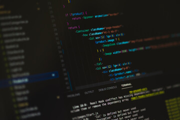 Programming language on black screen background, Javascript React code