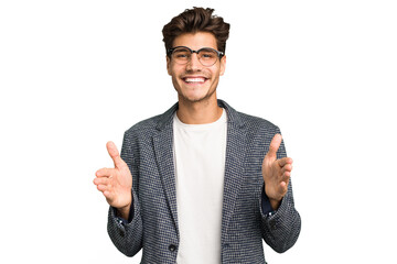 Wall Mural - Young caucasian handsome man isolated holding something with both hands, product presentation.