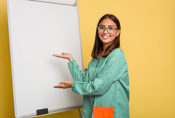 Wall Mural - Young caucasian child education teacher explaining on the blackboard isolated