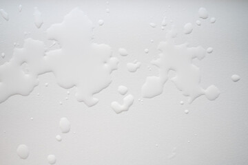 Water spilled on a white background. Flatley. Copy space.