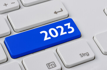 Wall Mural - a keyboard with a blue button - 2023