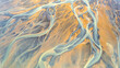 © AmazingAerialAgency - Aerial view of abstract water formation near Olfusa river bank in Iceland.